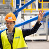 Carina Petersson, site manager for Stena Recycling Battery Center. She stands in the recycling facility in protective gear.