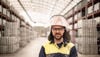 Oskar Rundberg, operatör på Stena Aluiminiums smältverk, klädd i hi-vis skyddsutrustning, står i anläggningen där aluminiumtackor förvaras.r, standing in the facility where aluminium ingots are stored. 