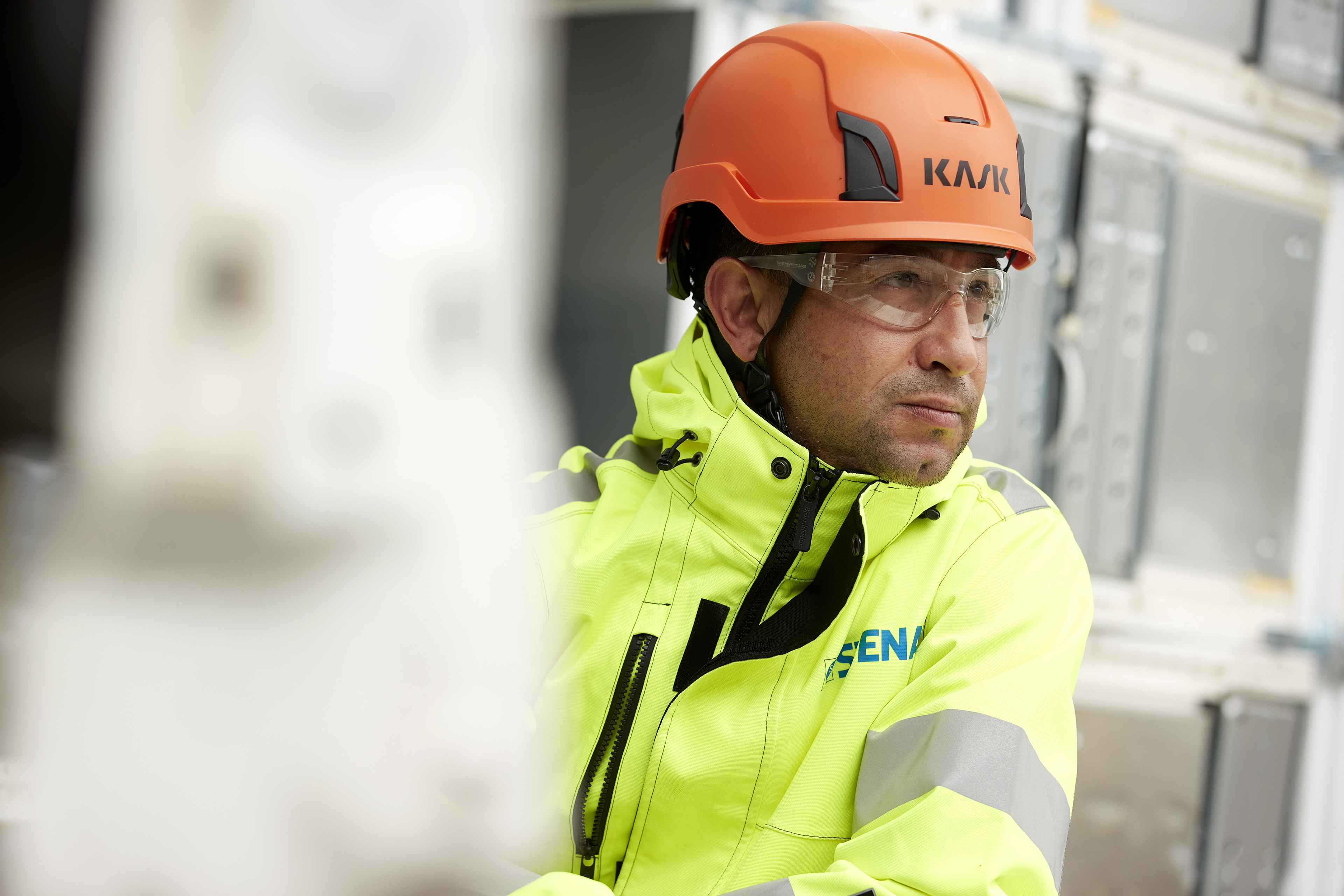 Close-up shot of a Stena Metall Group employee at work wearing hi-vis protective gear.