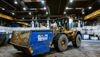 A wheel loader transporting a Stena Recycling container